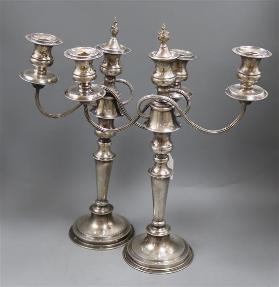 A pair of two branch three light plated candelabra height 45cm